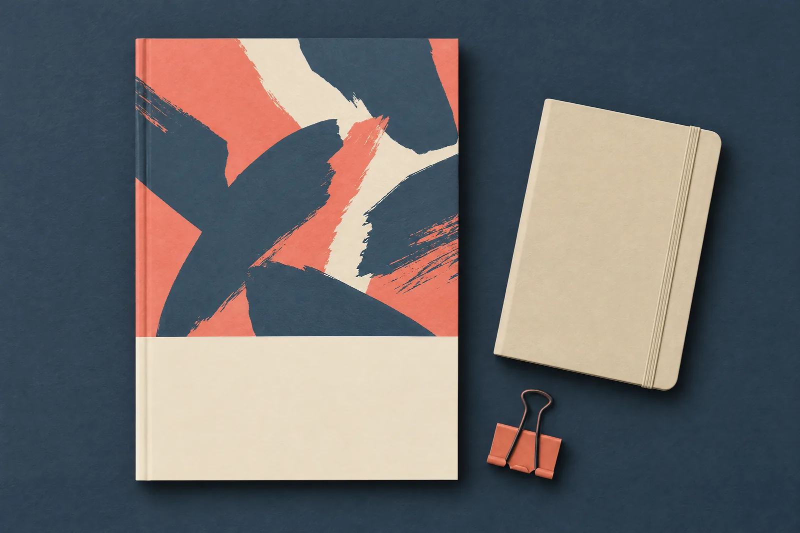 A mudroom bench still life of a ebook product arranged with a black binder clip, in coral, sand, slate, and cream.