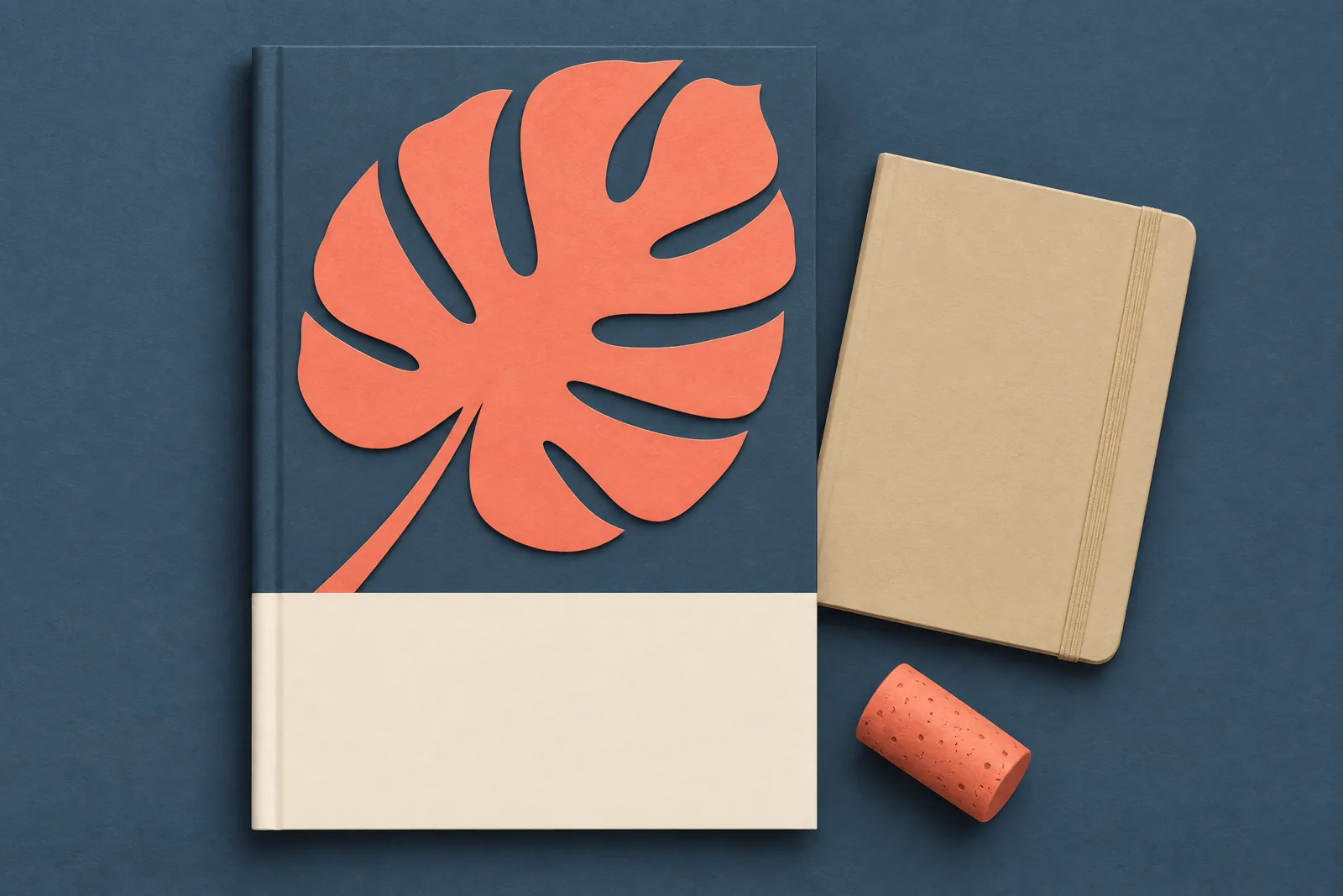 A studio apartment still life of a ebook product arranged with a cork, in coral, sand, slate, and cream.