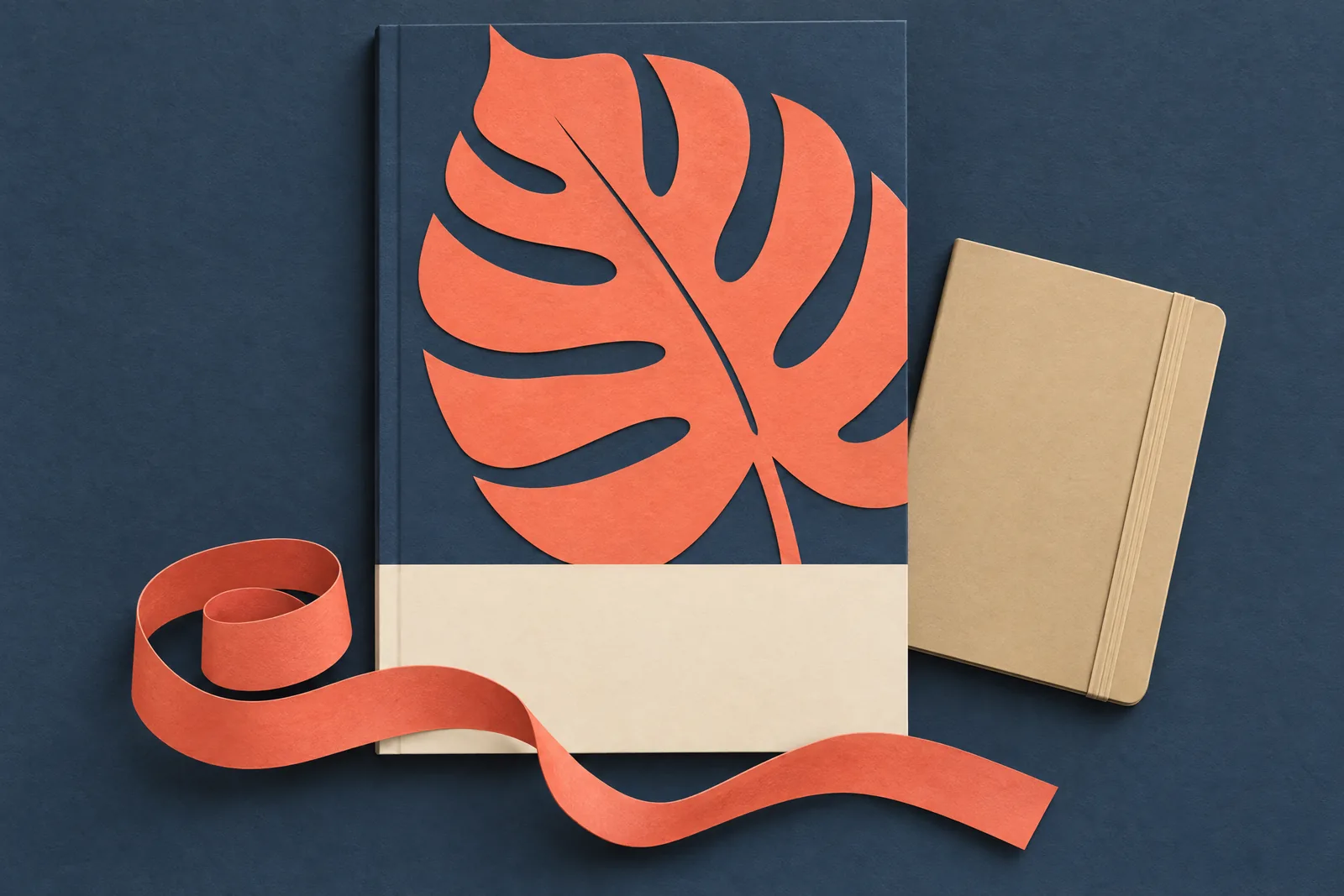 A record nook still life of a ebook product arranged with a coiled coral ribbon, in coral, sand, slate, and cream.